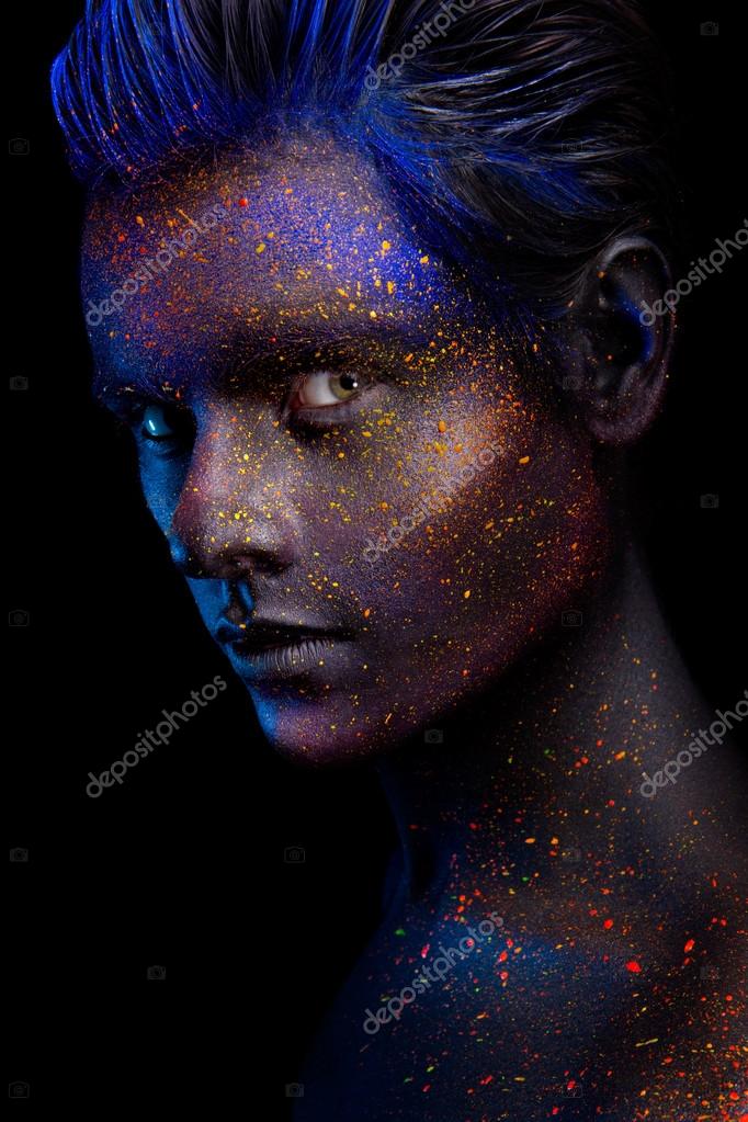 Glowing neon makeup with dramatic look in his eyes. Stock Photo by  ©korabkova 120649854